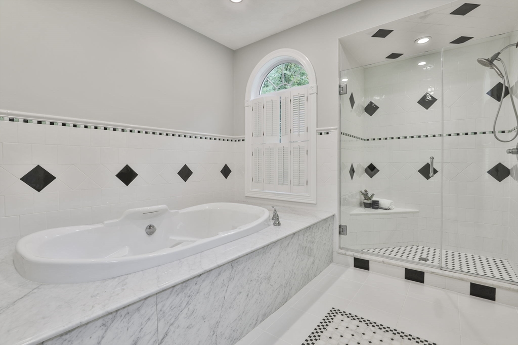 53 Cooper Street Wakefield, MA 01880 - Photo 22 of 42 a bathroom with a bathtub and shower