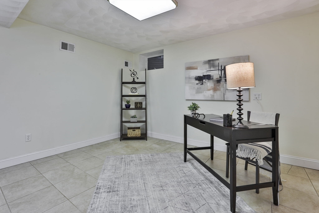 53 Cooper Street Wakefield, MA 01880 - Photo 35 of 42 a view of a livingroom with furniture and a window