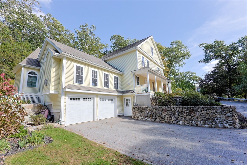 53 Cooper Street Wakefield, MA 01880 - Photo 36 of 42 a front view of a house with a garden and tree