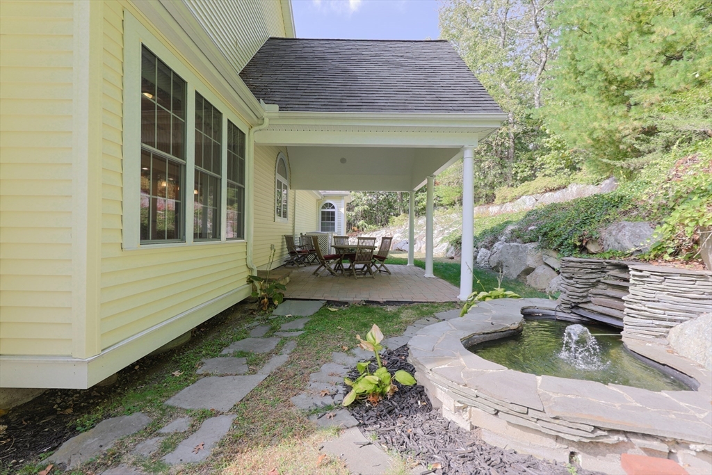 53 Cooper Street Wakefield, MA 01880 - Photo 37 of 42 a view of a house with backyard sitting area and garden