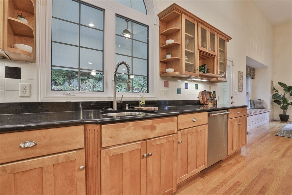 53 Cooper Street Wakefield, MA 01880 - Photo 7 of 42 a kitchen with stainless steel appliances a sink and cabinets