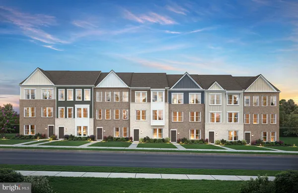 a view of houses with a yard