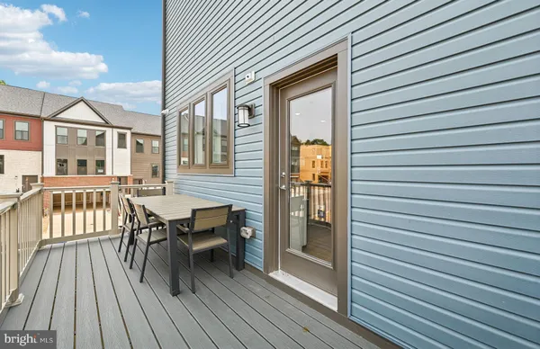 a view of a patio with wooden floor