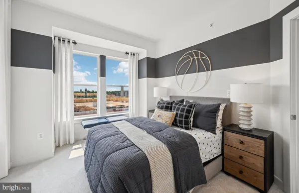 a bedroom with a bed and window