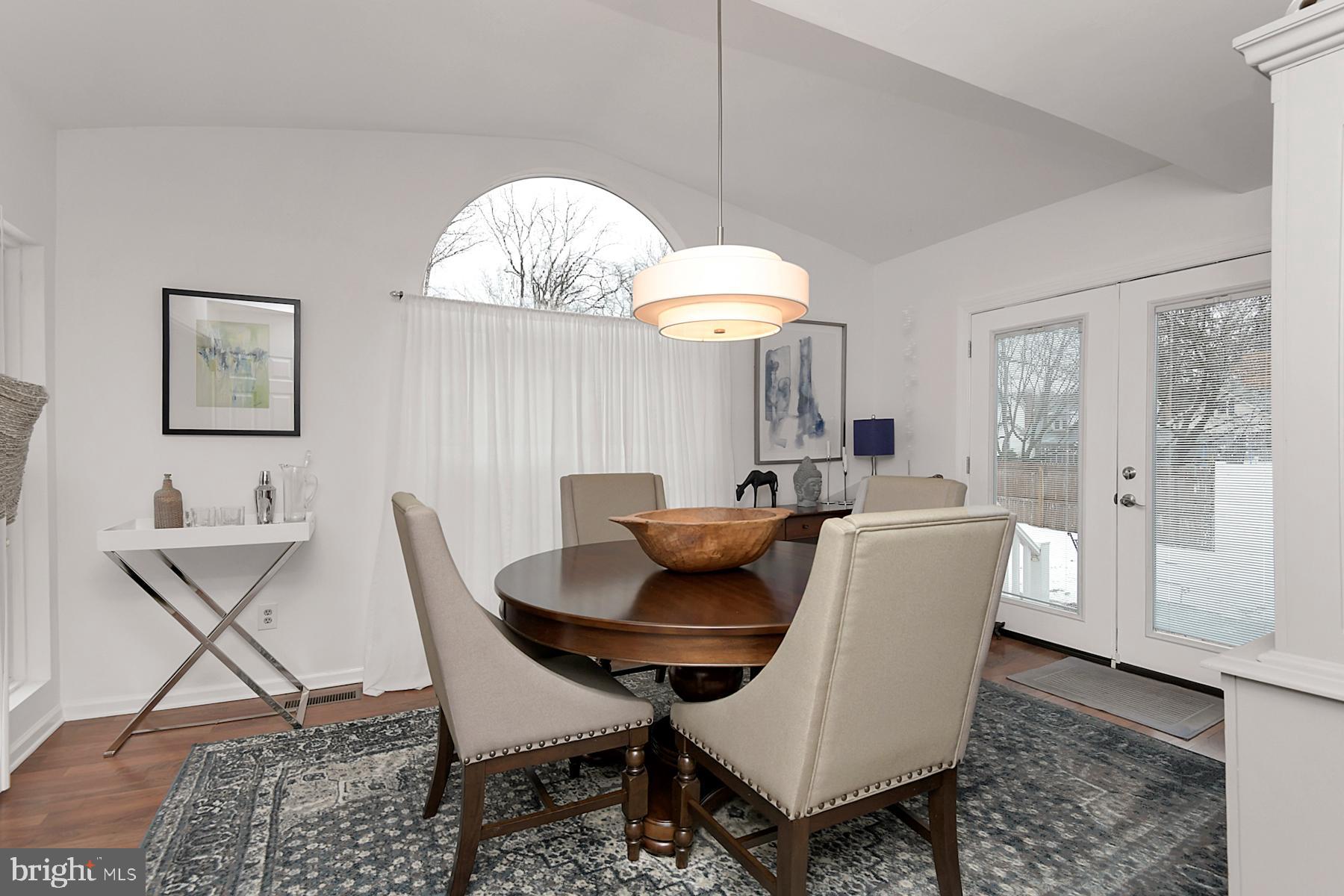 56 Ridgewood Avenue Ewing, NJ 08618 - Photo 12 of 28 a view of a dining room with furniture and a chandelier
