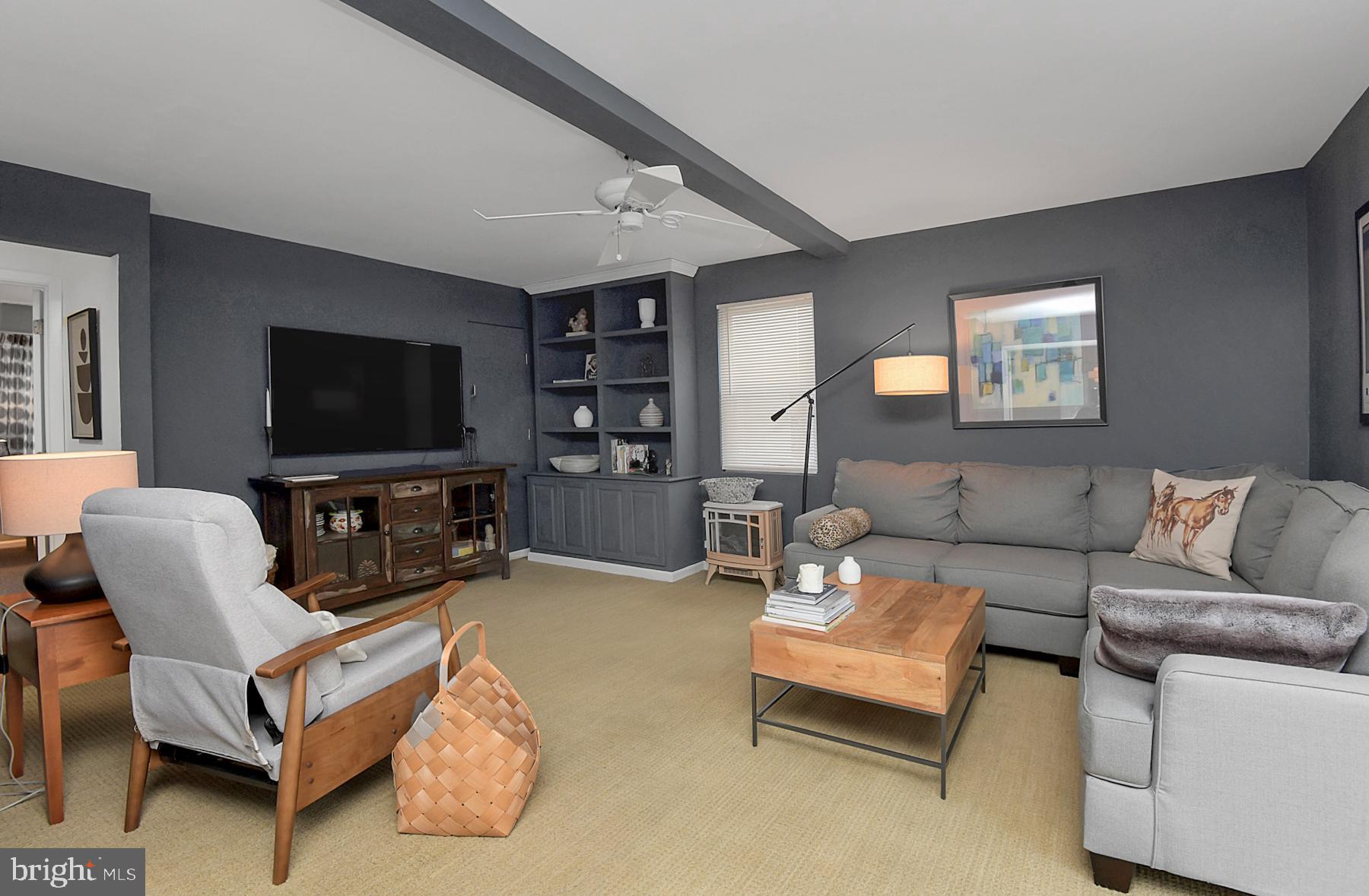 56 Ridgewood Avenue Ewing, NJ 08618 - Photo 14 of 28 a living room with furniture and a flat screen tv