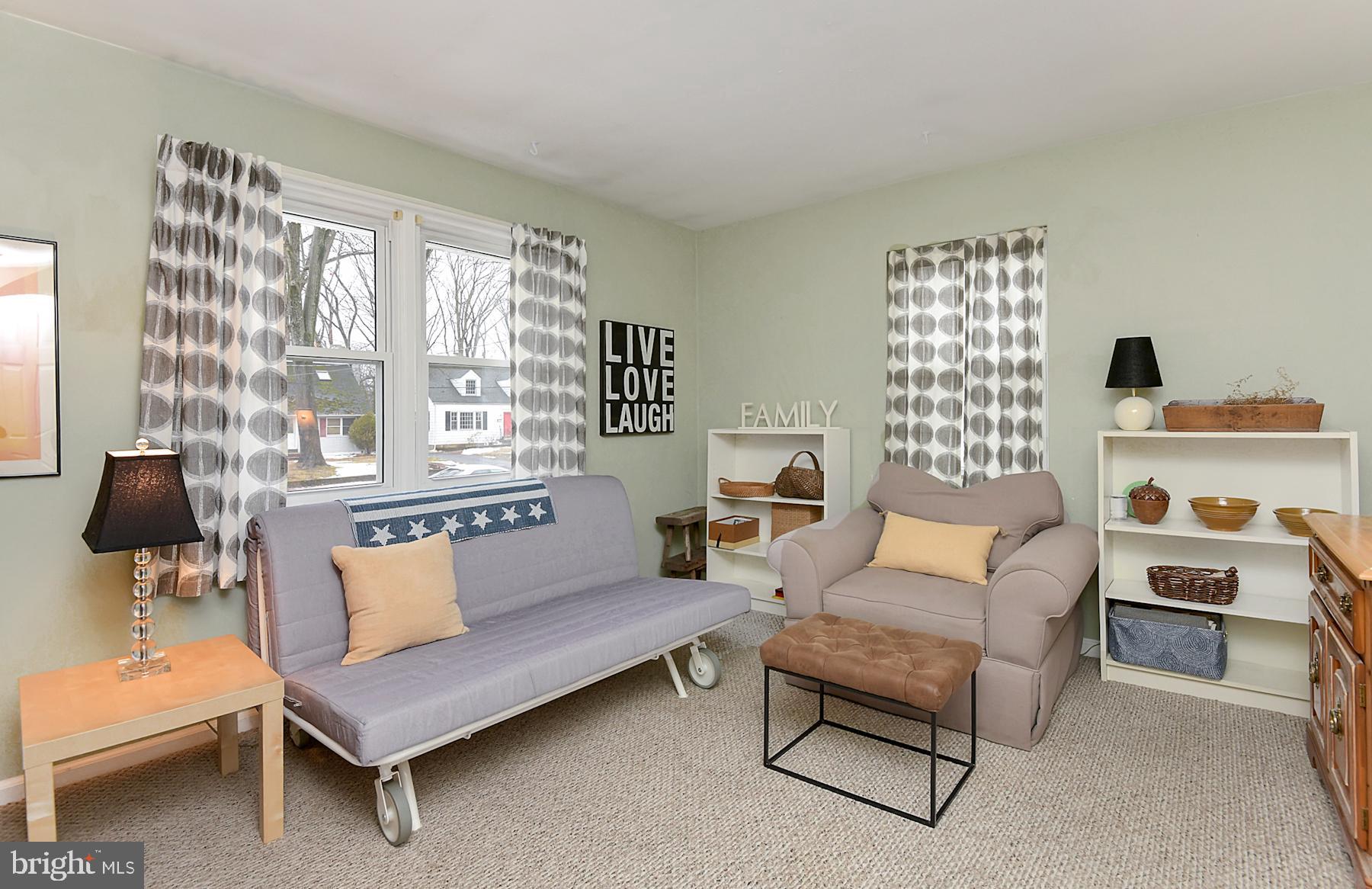 56 Ridgewood Avenue Ewing, NJ 08618 - Photo 17 of 28 a living room with furniture and a large window
