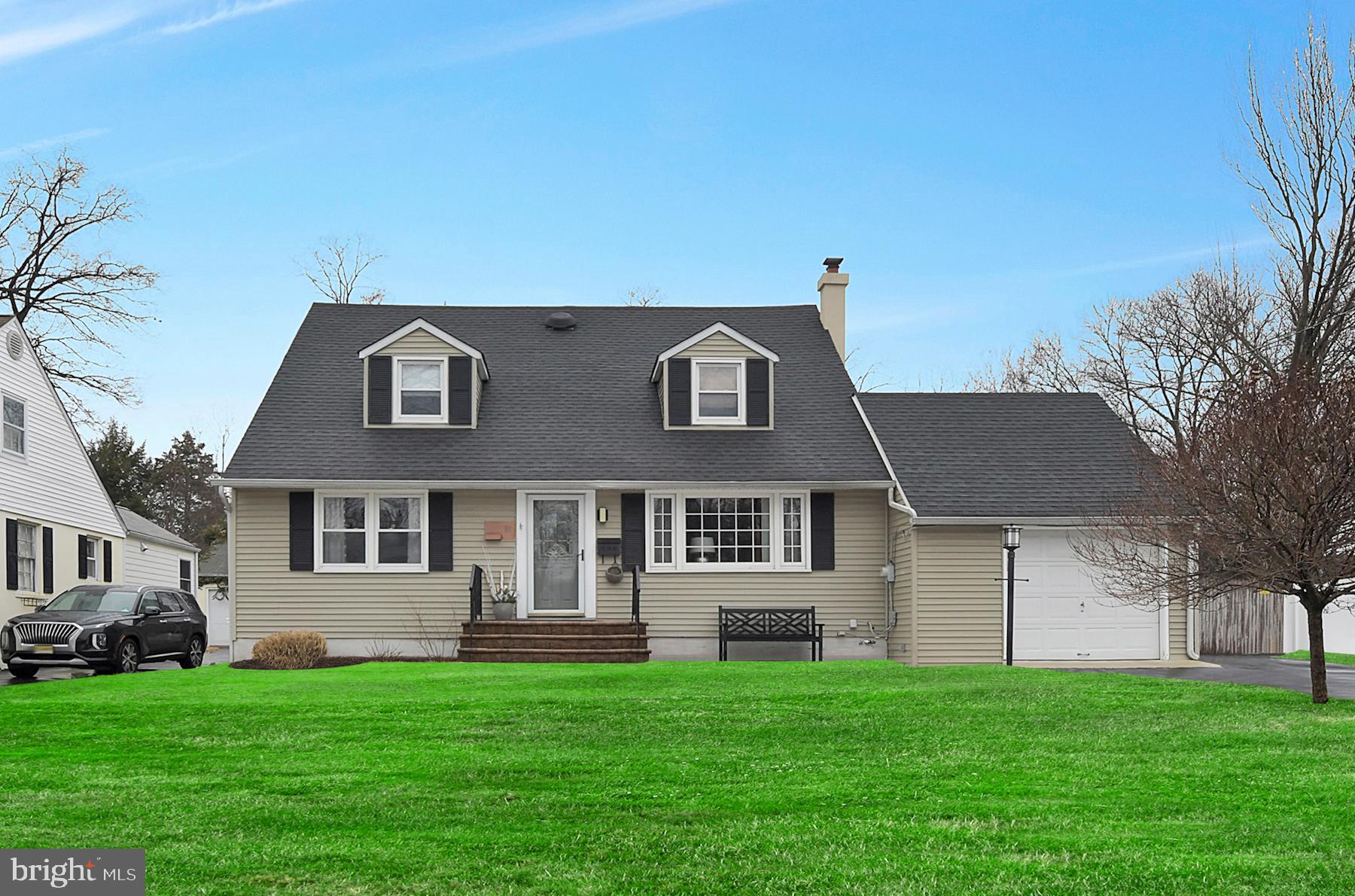 56 Ridgewood Avenue Ewing, NJ 08618 - Photo 2 of 28 a front view of a house with a garden
