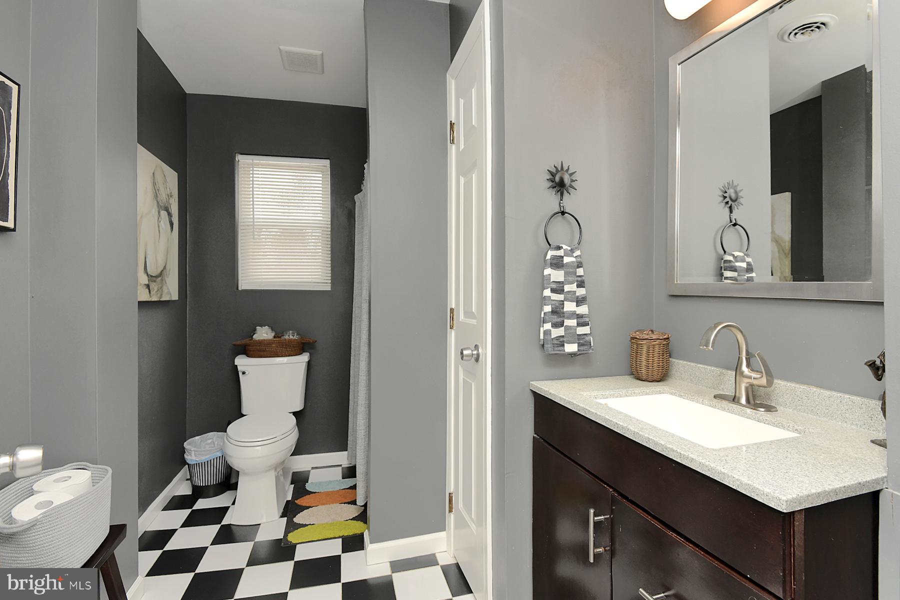 56 Ridgewood Avenue Ewing, NJ 08618 - Photo 23 of 28 a bathroom with a sink toilet and shower