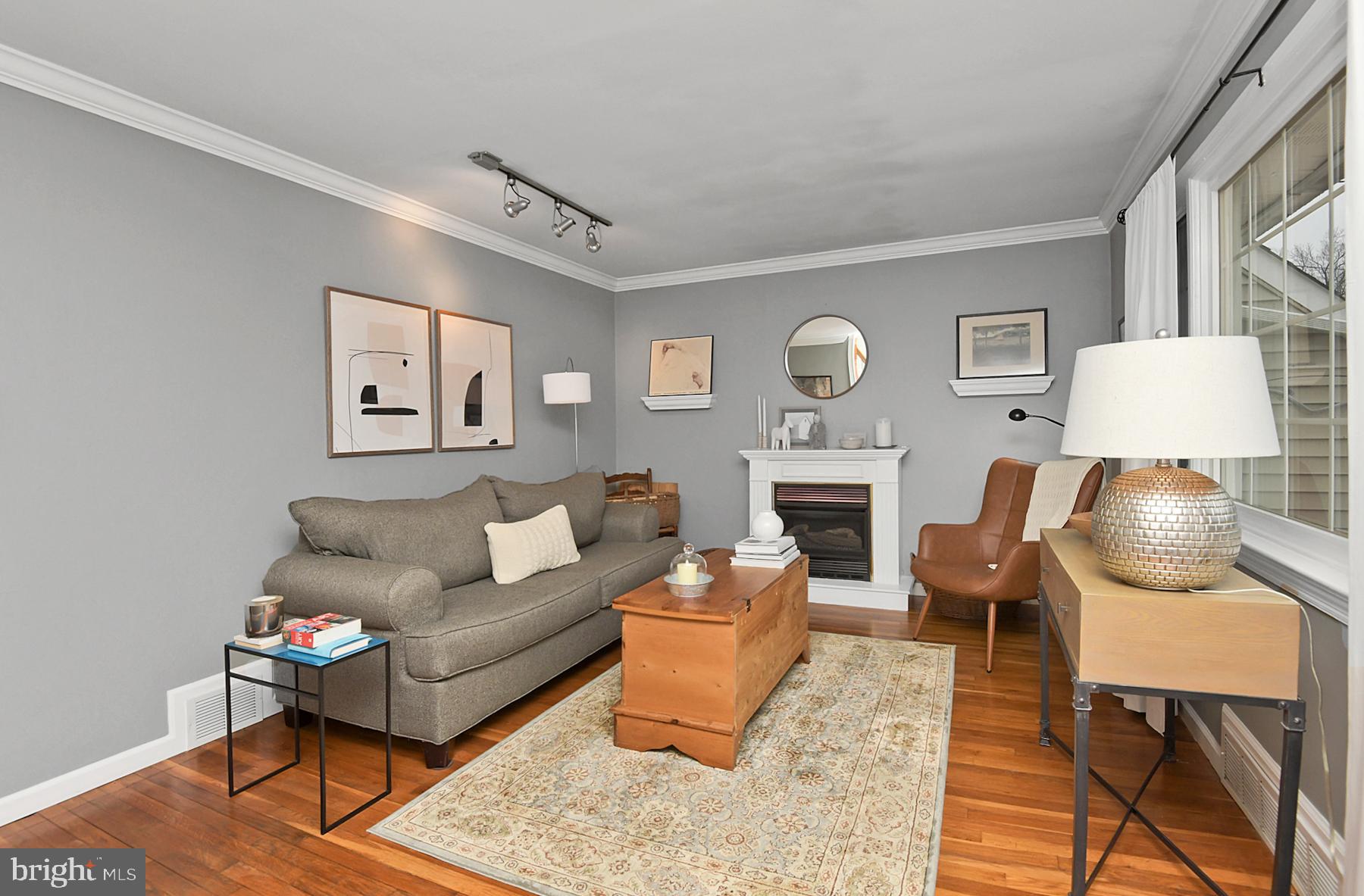 56 Ridgewood Avenue Ewing, NJ 08618 - Photo 6 of 28 a living room with furniture a fireplace and a table
