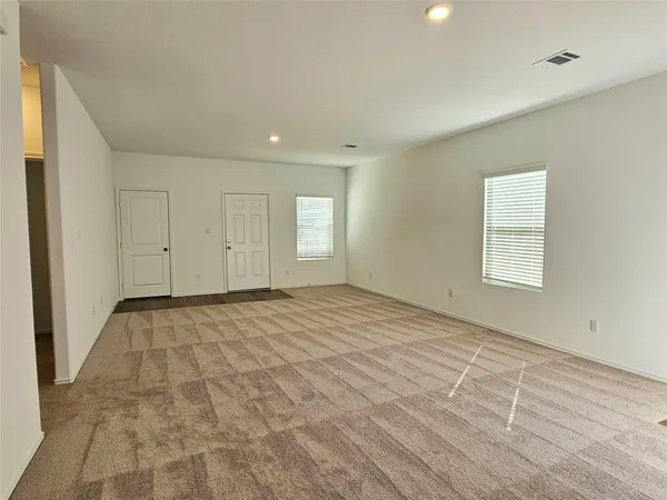 a kitchen with stainless steel appliances a refrigerator and a stove top oven
