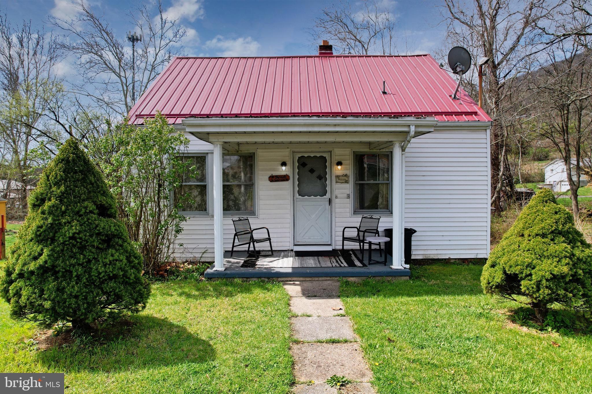 159 Rocket Center Road Keyser, WV 26726 - Photo 57 of 64 a front view of a house with garden