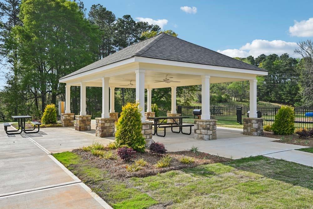73 Silverleaf Trail Bethlehem, GA 30620 - Photo 23 of 25 a view of a house with backyard sitting area and porch