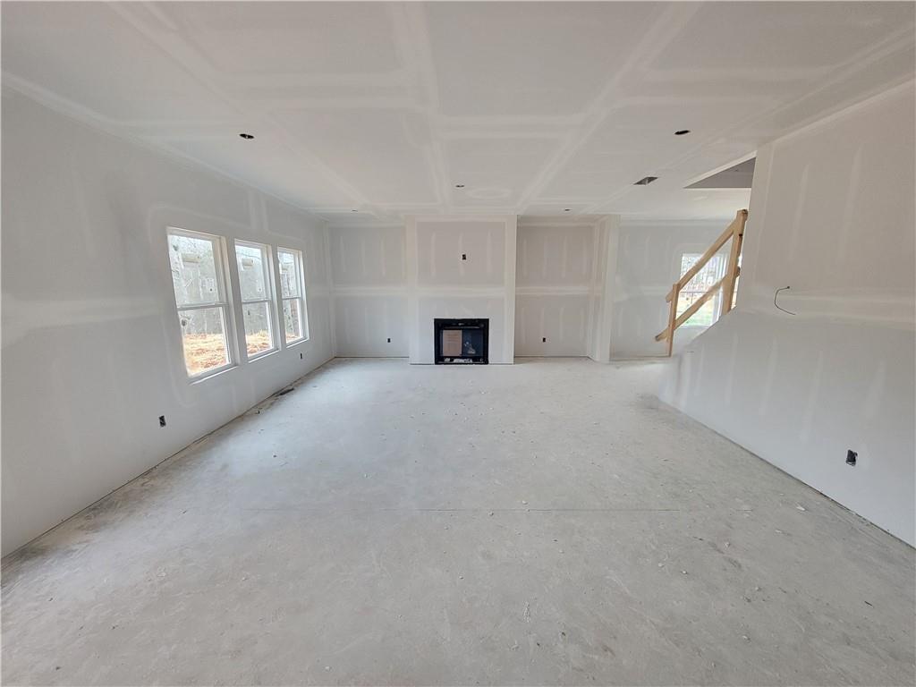 73 Silverleaf Trail Bethlehem, GA 30620 - Photo 8 of 25 a view of a livingroom with a fireplace and window
