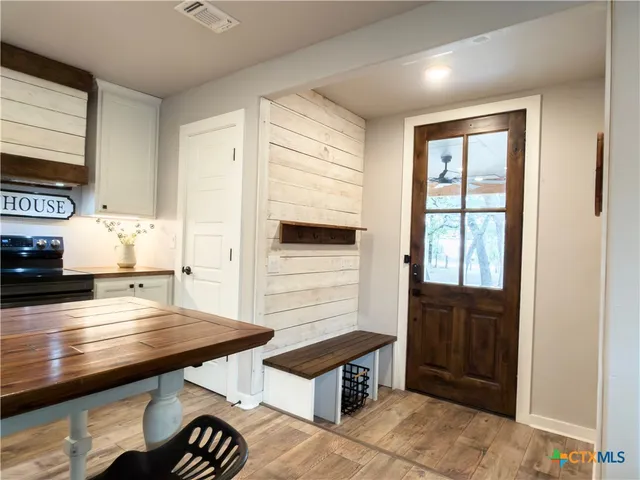 a view of kitchen island with furniture and wooden floor