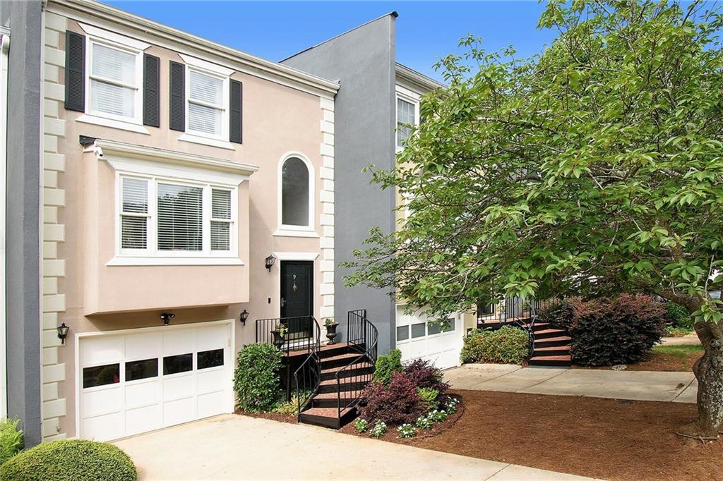 9 Sycamore Station Decatur, GA 30030 - Photo 1 of 1 a view of a large building with large windows and a yard
