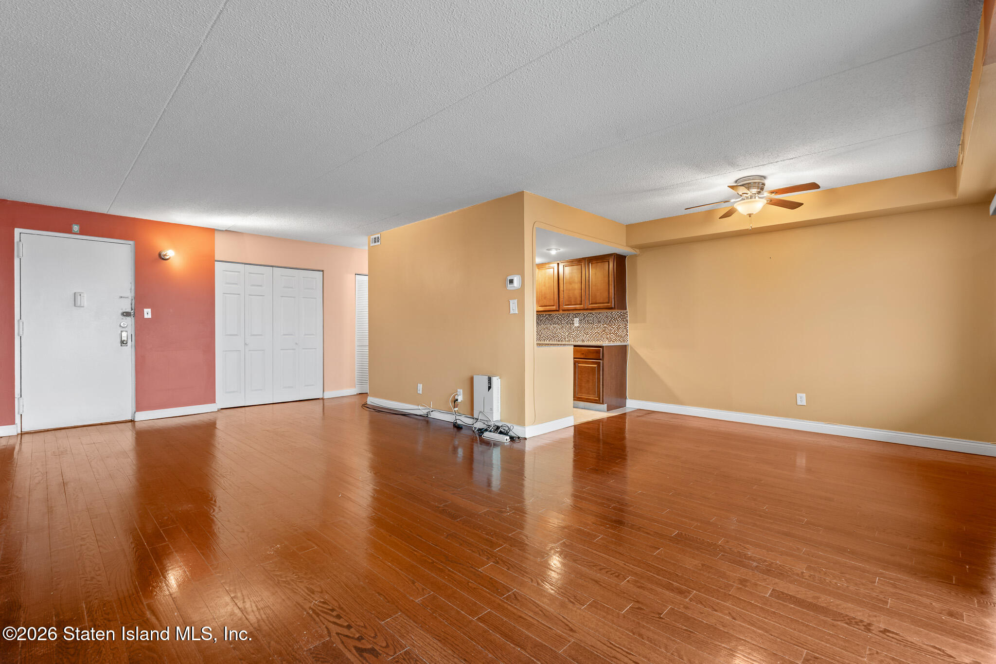 11 Windham Loop, Unit 5LL Staten Island, NY 10314 - Photo 7 of 19 a view of empty room with wooden floor