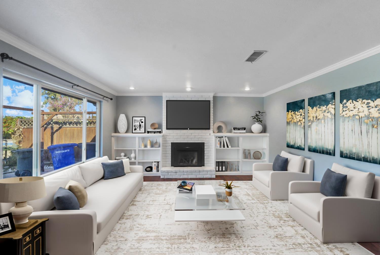 728 R Street Newman, CA 95360 - Photo 11 of 19 a living room with furniture a fireplace and a large window