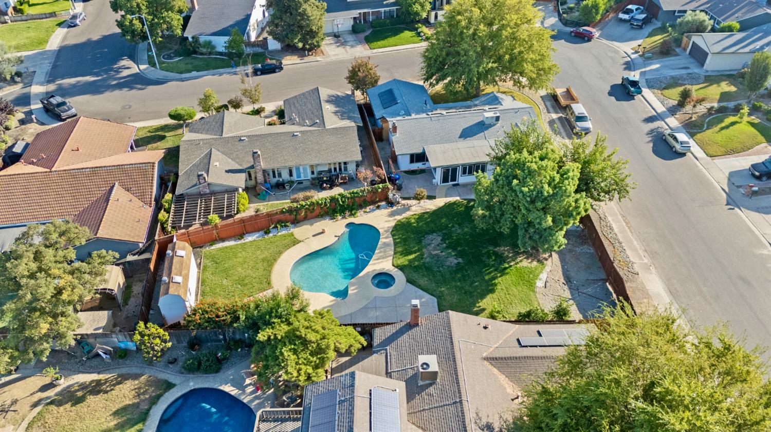 728 R Street Newman, CA 95360 - Photo 18 of 19 an aerial view of a house with yard swimming pool and outdoor seating