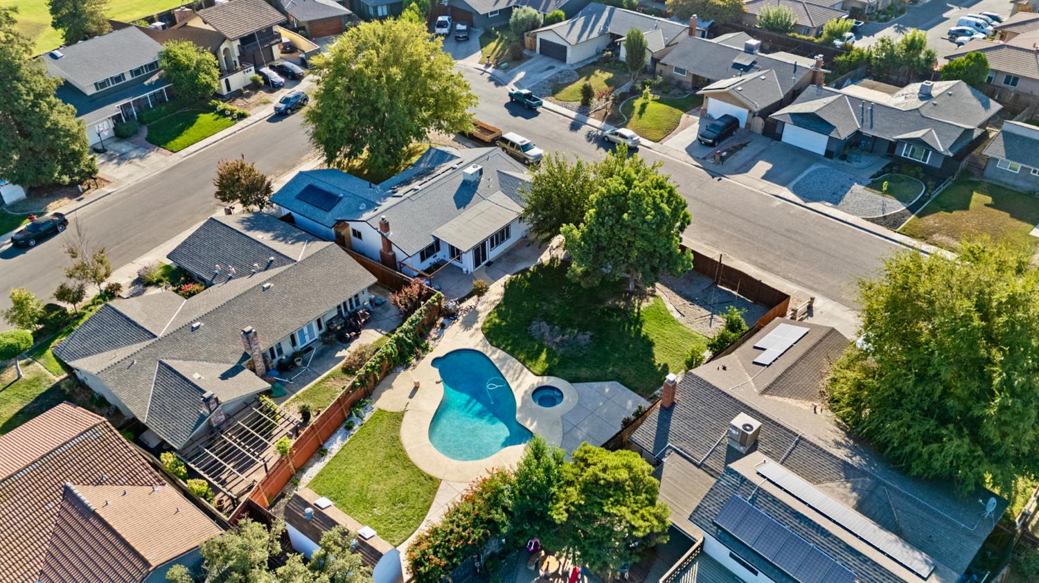 728 R Street Newman, CA 95360 - Photo 19 of 19 an aerial view of a house with garden space and street view