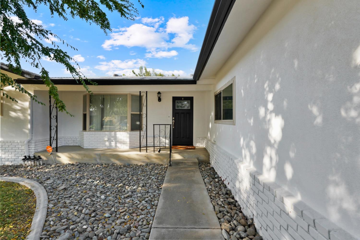 728 R Street Newman, CA 95360 - Photo 2 of 19 a view of a house with a porch