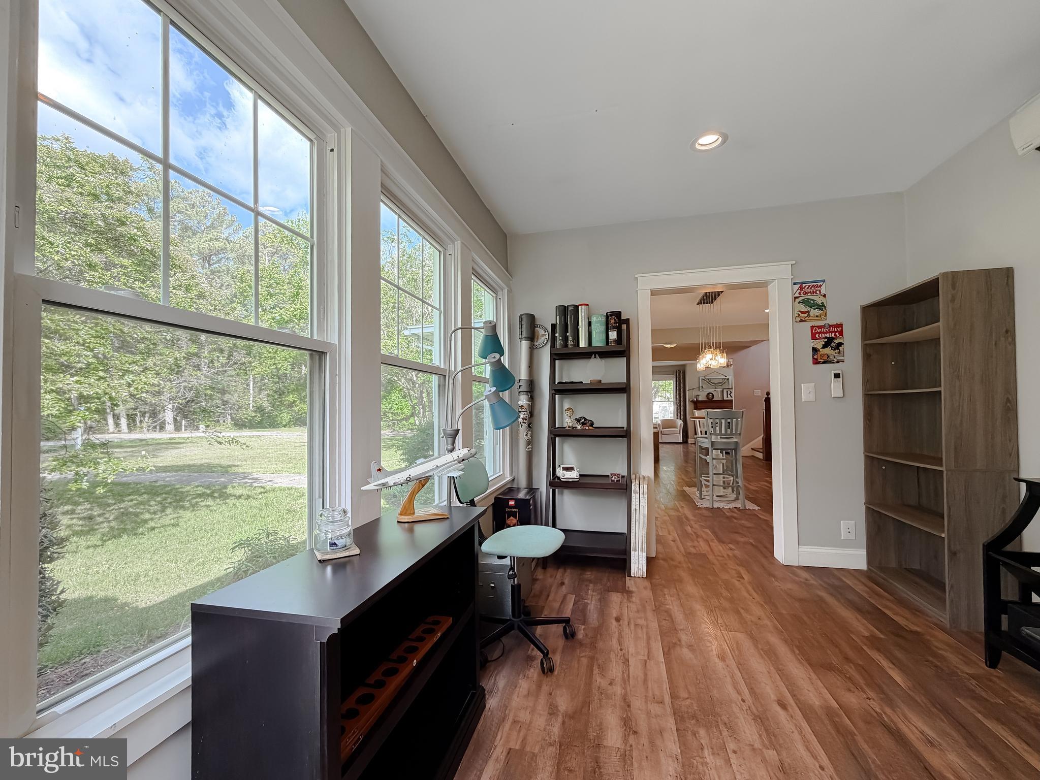 16146 Thomas Road Piney Point, MD 20674 - Photo 10 of 57 a room with furniture wooden floor and a large window