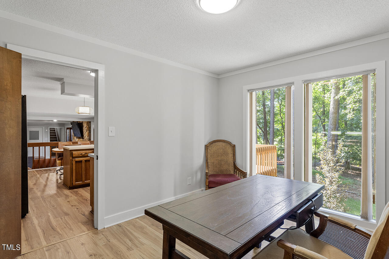 705 Lanham Place Raleigh, NC 27615 - Photo 11 of 53 a view of a workspace with furniture and a window