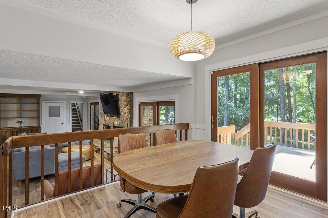 705 Lanham Place Raleigh, NC 27615 - Photo 16 of 53 a view of a dining room with furniture window and wooden floor
