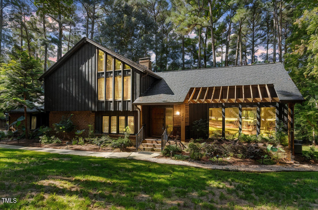 705 Lanham Place Raleigh, NC 27615 - Photo 2 of 53 a front view of house with yard and green space