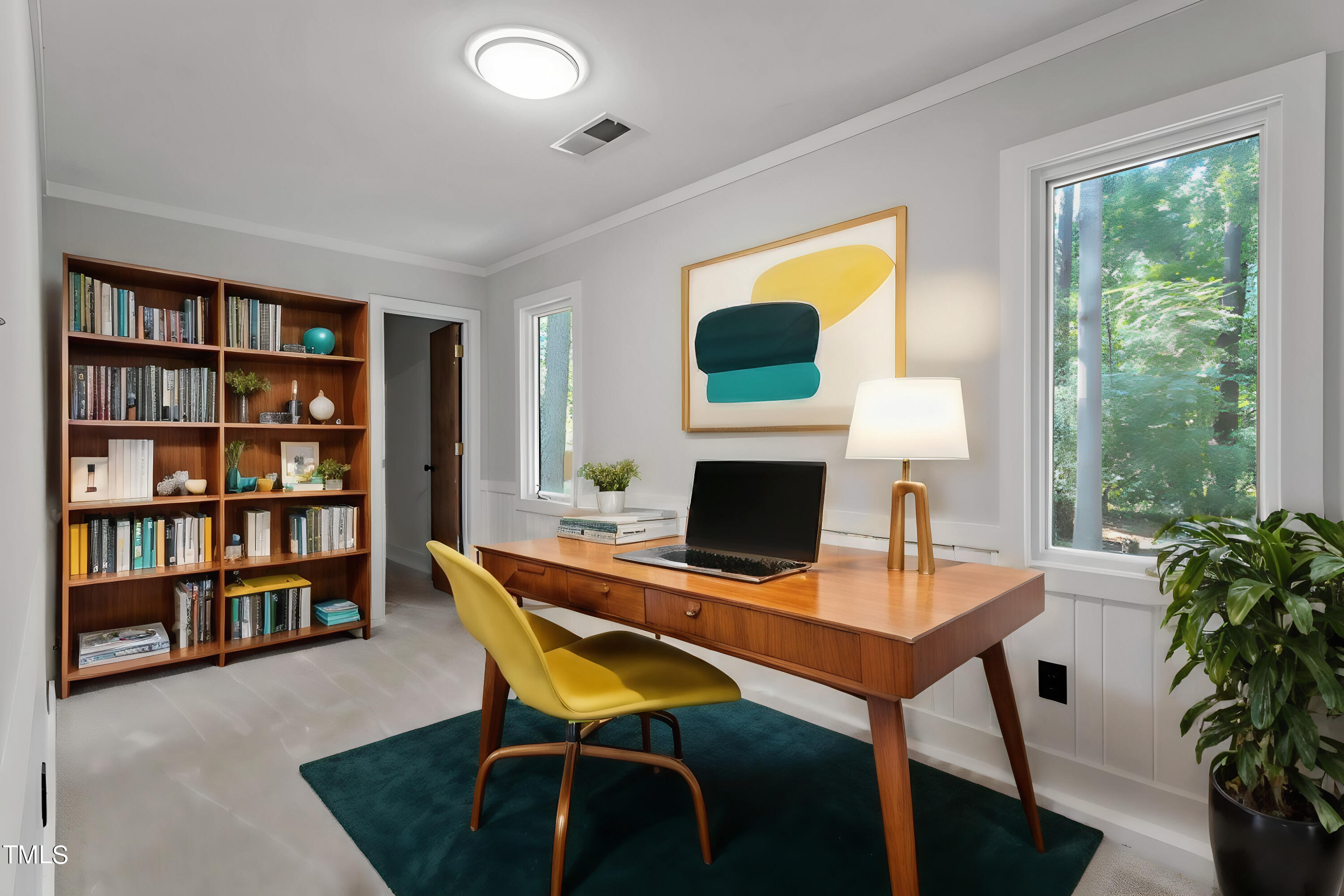 705 Lanham Place Raleigh, NC 27615 - Photo 26 of 53 a work room with furniture and a bookshelf
