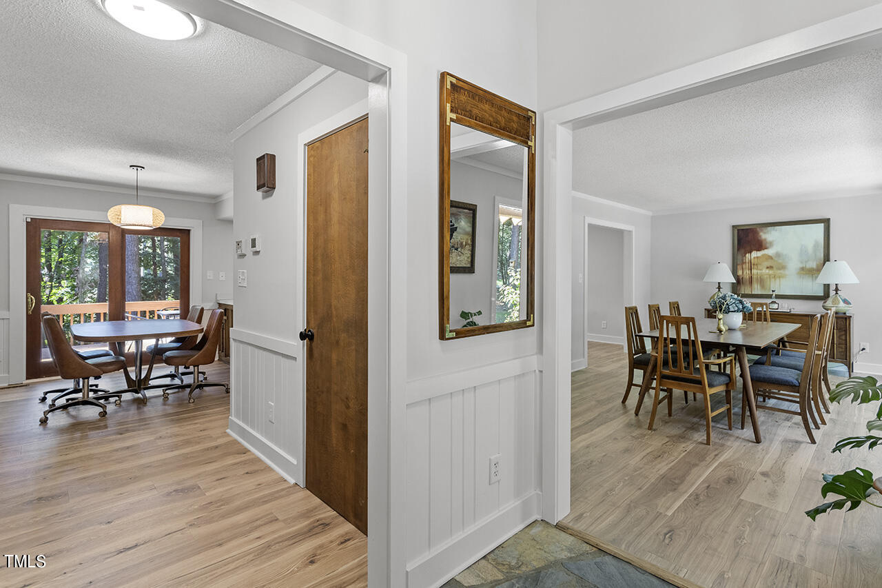 705 Lanham Place Raleigh, NC 27615 - Photo 3 of 53 a view of a livingroom and dining room and wooden floor