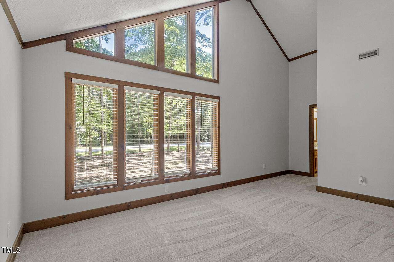 705 Lanham Place Raleigh, NC 27615 - Photo 31 of 53 a view of an empty room with a window