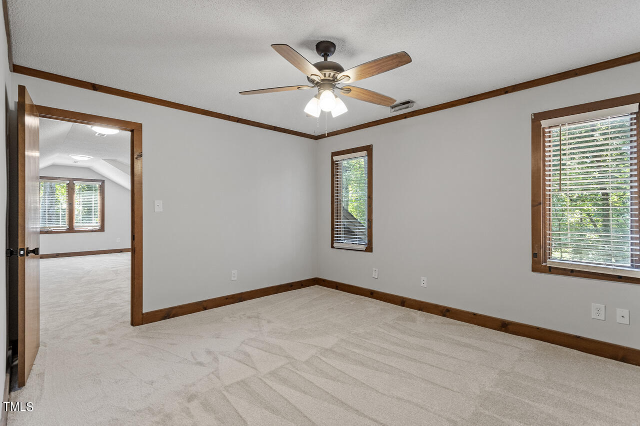 705 Lanham Place Raleigh, NC 27615 - Photo 36 of 53 an empty room with window and ceiling fan