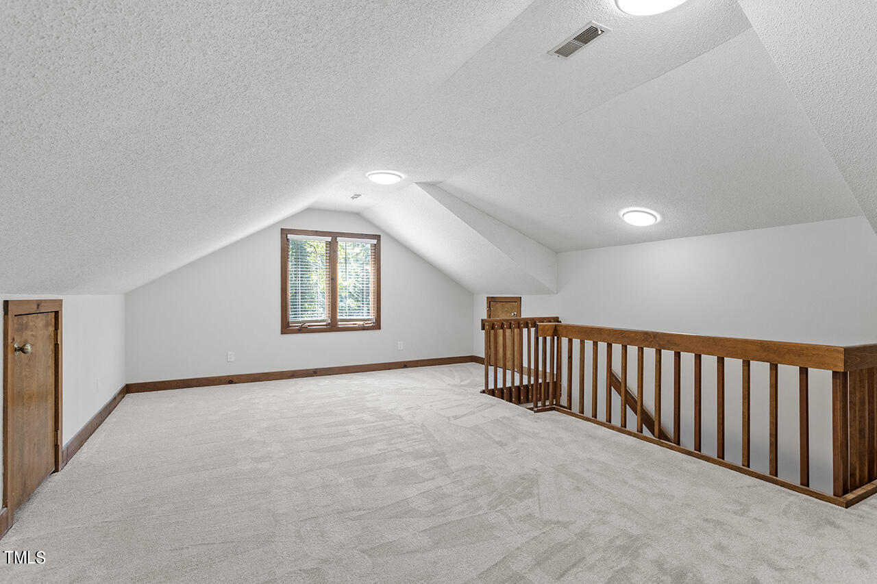 705 Lanham Place Raleigh, NC 27615 - Photo 38 of 53 a view of an empty room with a window