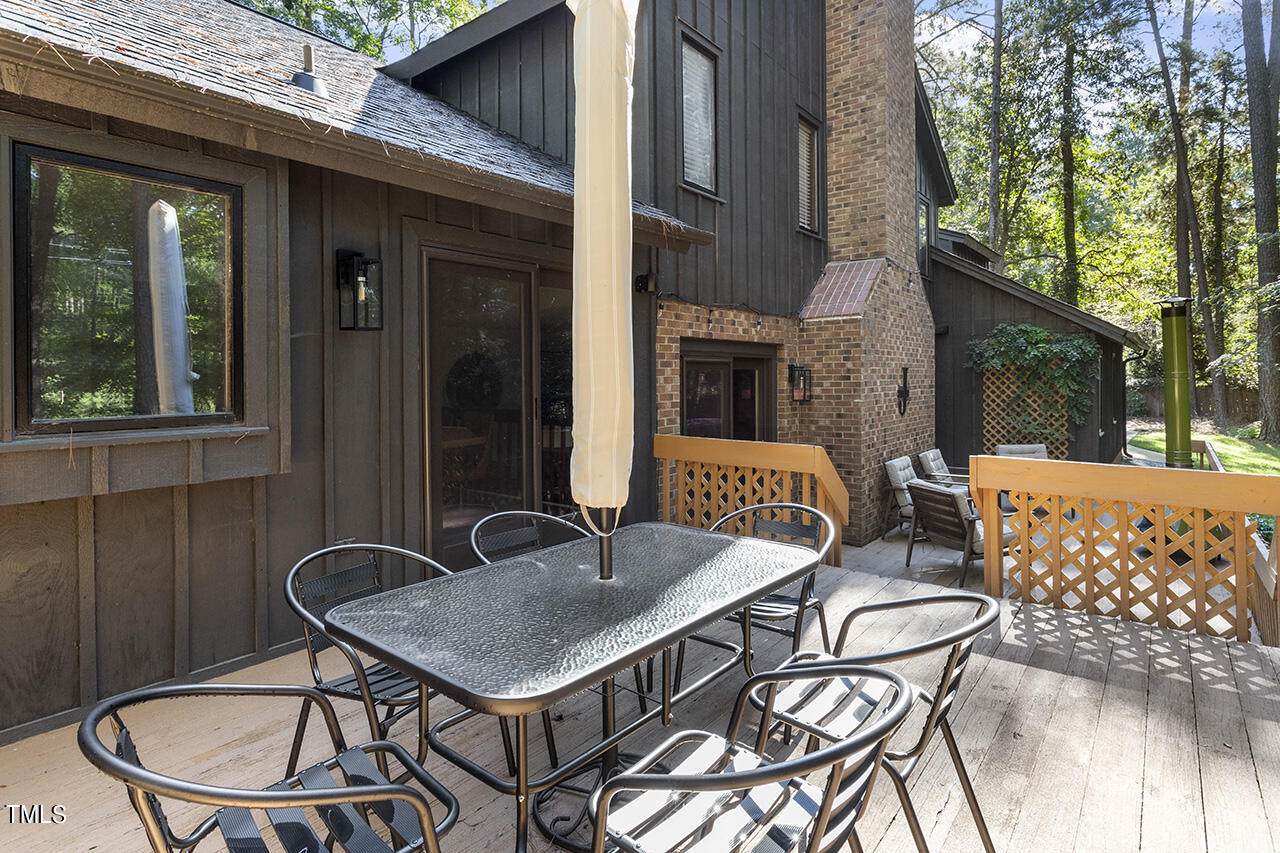 705 Lanham Place Raleigh, NC 27615 - Photo 39 of 53 a backyard of a house with table and chairs