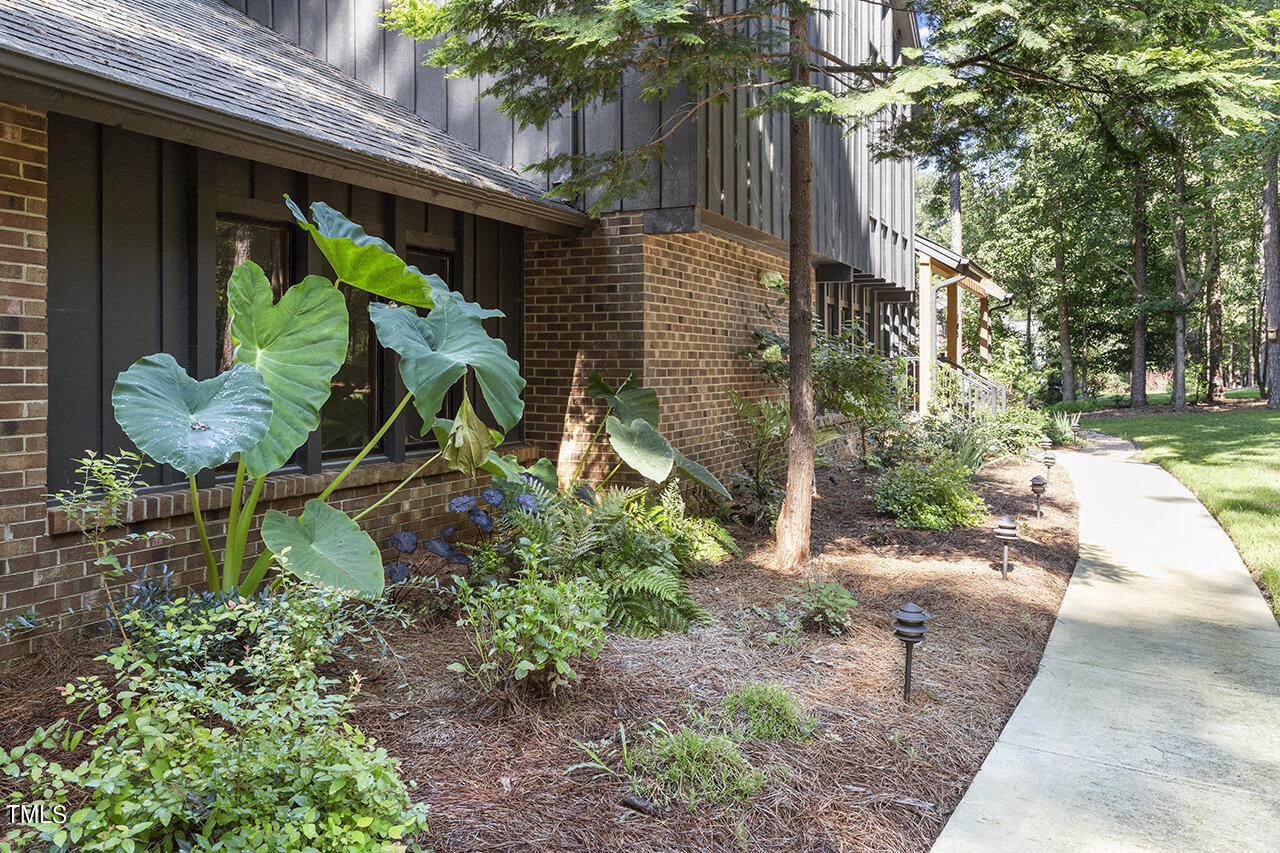 705 Lanham Place Raleigh, NC 27615 - Photo 44 of 53 a backyard of a house with lots of green space
