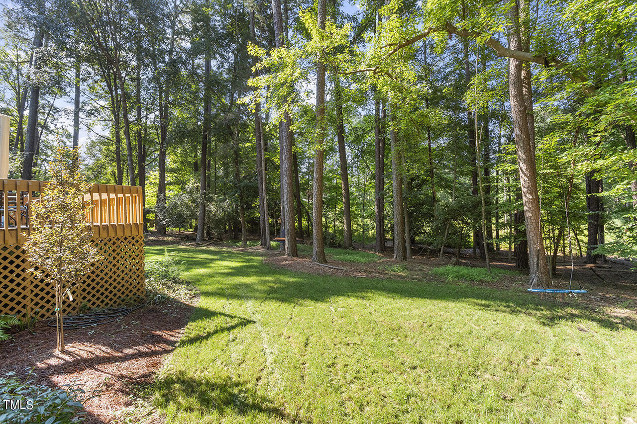 705 Lanham Place Raleigh, NC 27615 - Photo 45 of 53 a view of a backyard with tree s