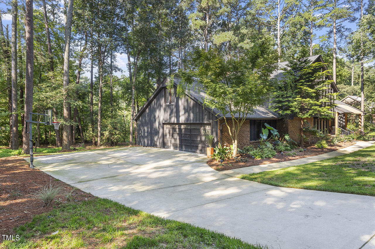 705 Lanham Place Raleigh, NC 27615 - Photo 48 of 53 a dirt road with trees in front of it