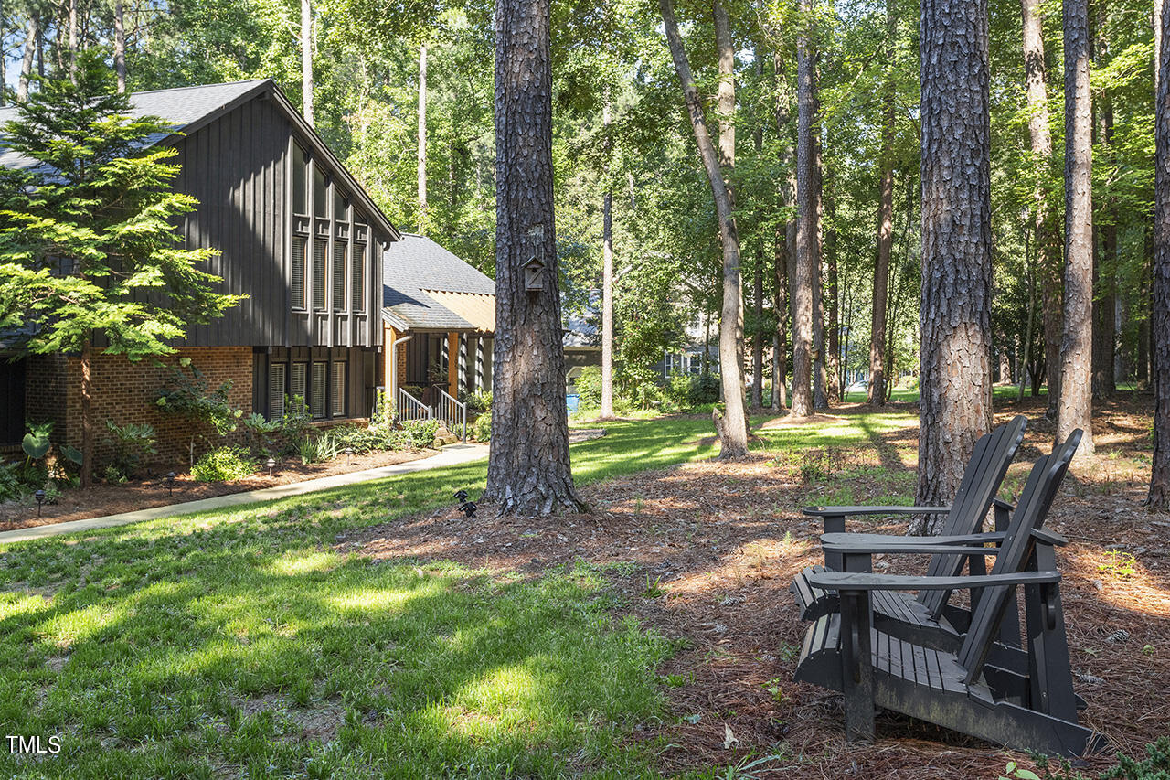 705 Lanham Place Raleigh, NC 27615 - Photo 49 of 53 a view of a house with backyard and a slide