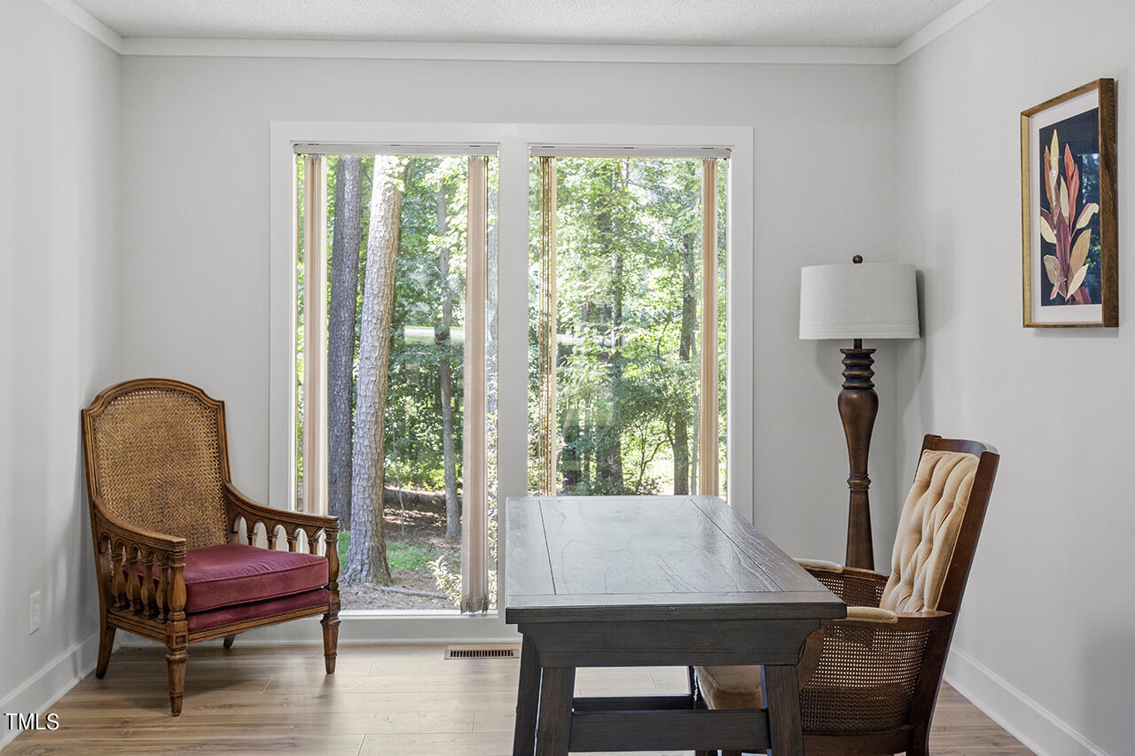 705 Lanham Place Raleigh, NC 27615 - Photo 10 of 53 a view of a workspace with furniture and a window