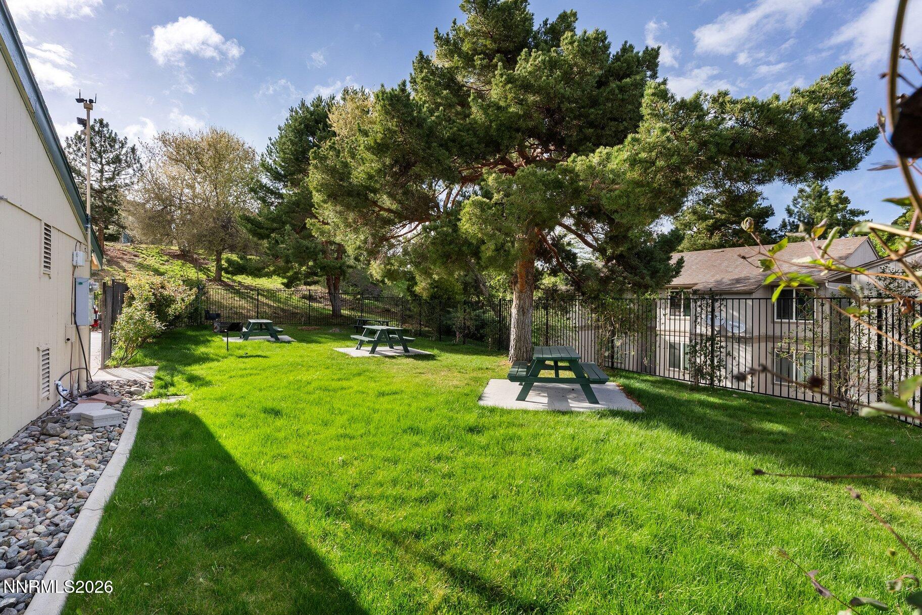 3935 Clear Acre Lane, Unit 211 Reno, NV 89512 - Photo 18 of 25 a view of a park with large trees