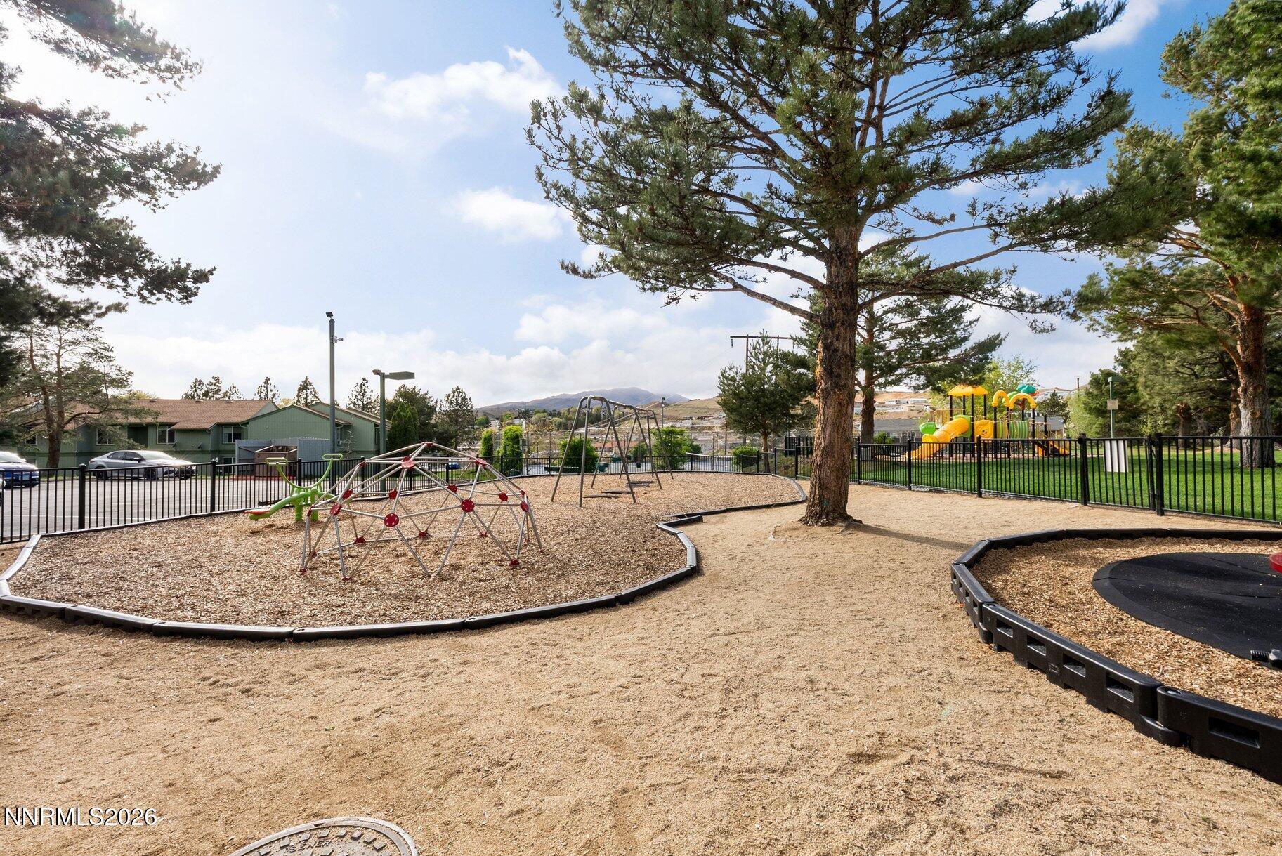 3935 Clear Acre Lane, Unit 211 Reno, NV 89512 - Photo 20 of 25 a view of outdoor space with playground and green space