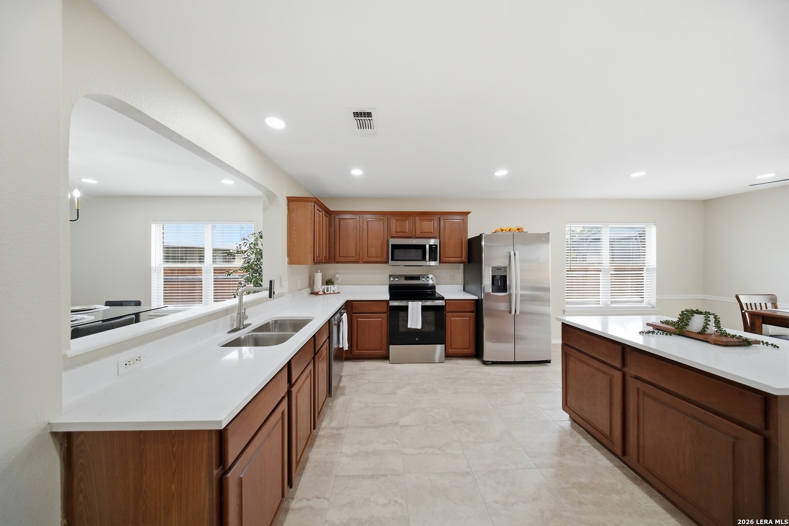 5607 Spring Quail San Antonio, TX 78247 - Photo 6 of 25 a kitchen with a sink stove and cabinets