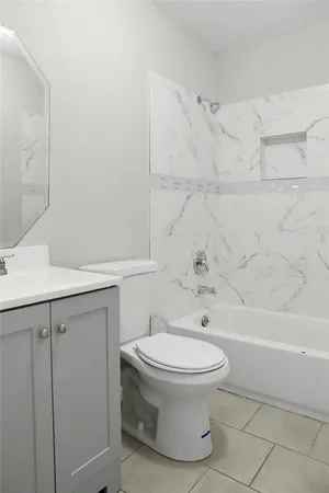 a bathroom with a toilet and a sink