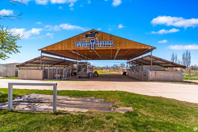 5321 South 3100th Street West Roy, UT 84067 - Photo 6 of 64 Large stables structure featuring a prominent wood-finish facade and metal roofing