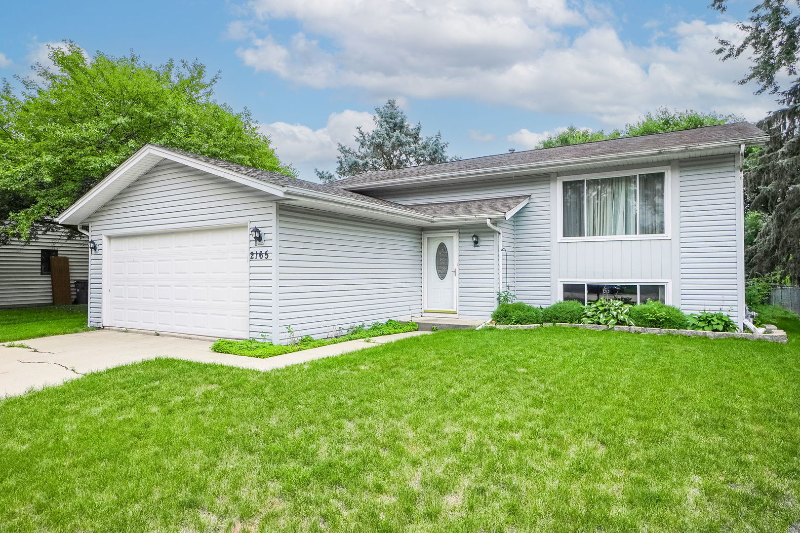 2165 Savannah Road Elgin, IL 60123 - Photo 1 of 27 a front view of house with yard and green space