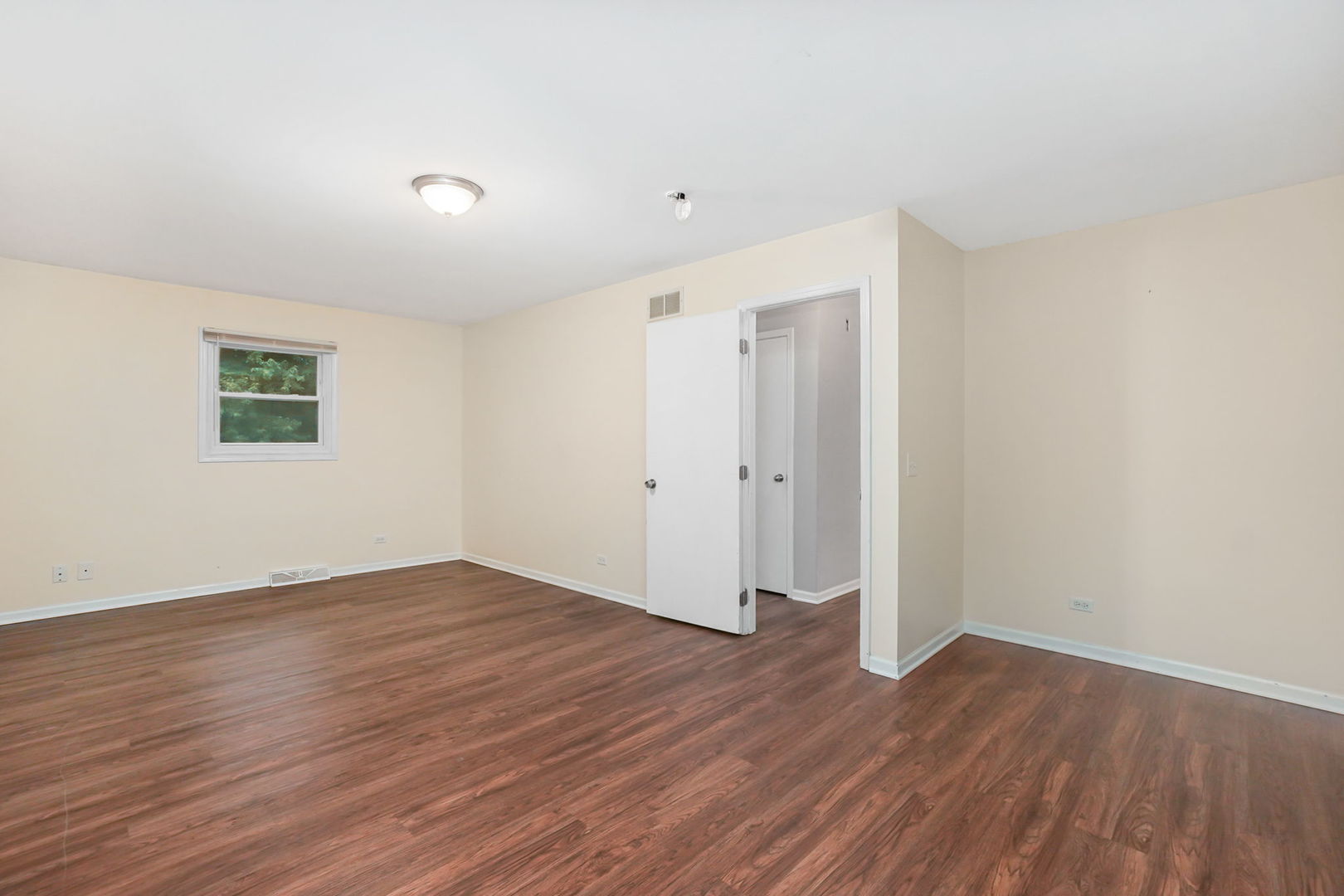 2165 Savannah Road Elgin, IL 60123 - Photo 12 of 27 a view of an empty room with wooden floor