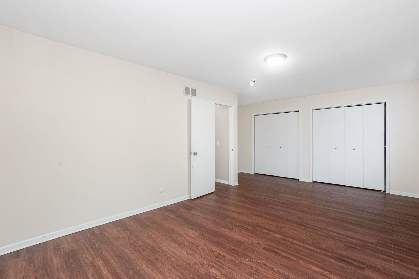 2165 Savannah Road Elgin, IL 60123 - Photo 13 of 27 a view of an empty room with wooden floor
