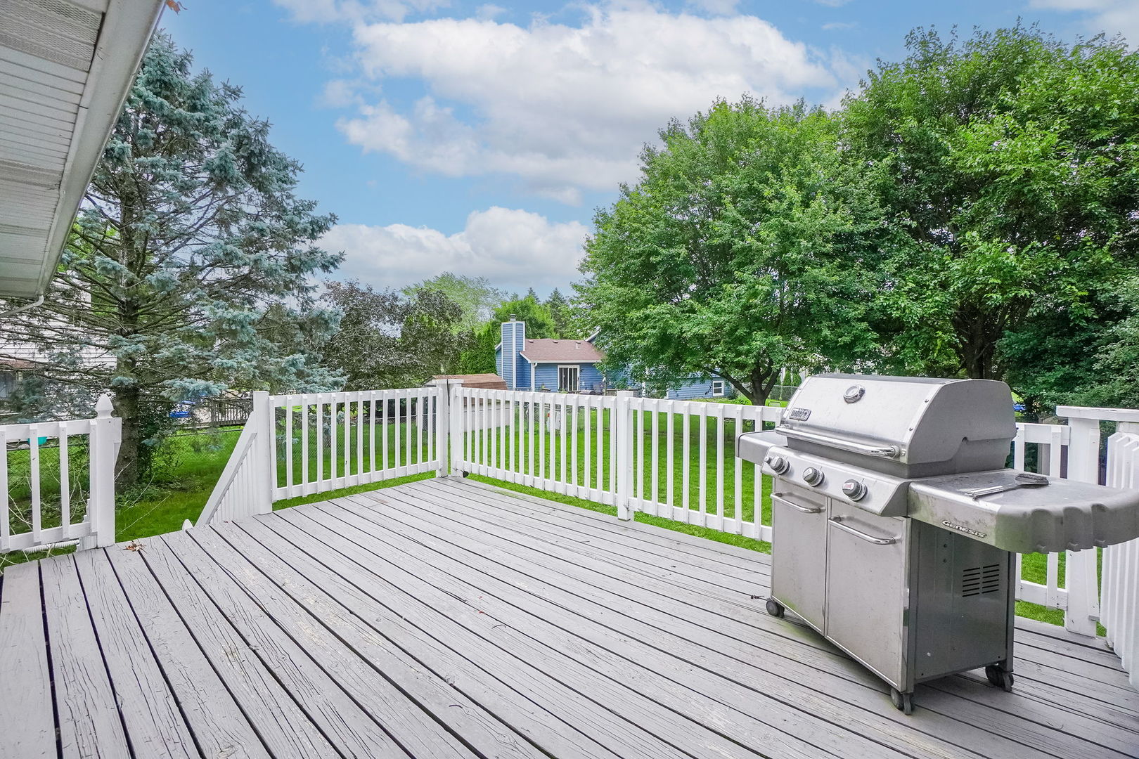 2165 Savannah Road Elgin, IL 60123 - Photo 27 of 27 a view of a deck with two chairs and a table with wooden floor