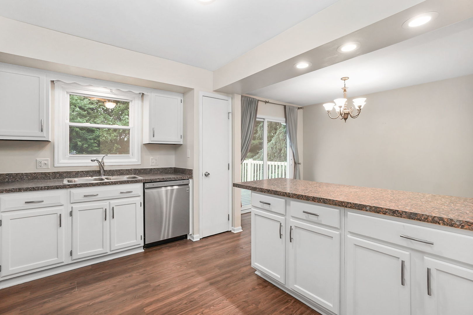 2165 Savannah Road Elgin, IL 60123 - Photo 6 of 27 a kitchen with granite countertop white cabinets and a window